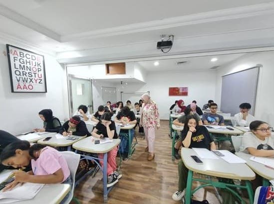 Eng. Radwa Galal conducting a mathematics workshop.